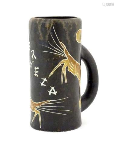 A Spanish studio pottery beer tankard with prawn decoration ...