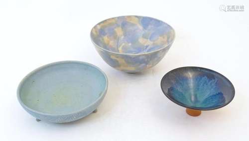 Three items of studio pottery comprising a three footed bowl...