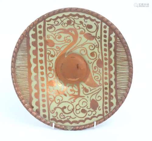 A Spanish Arts & Crafts style lustre dish with bird, fol...