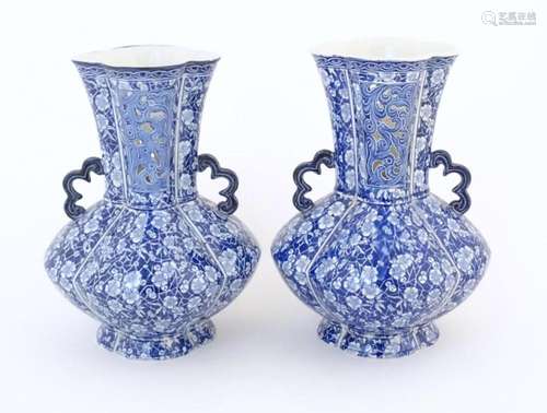 A pair of Continental blue and white twin handled vases with...