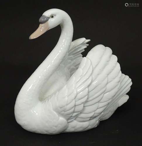 A Lladro model of a swan, model no. 5231. Marked under. Appr...