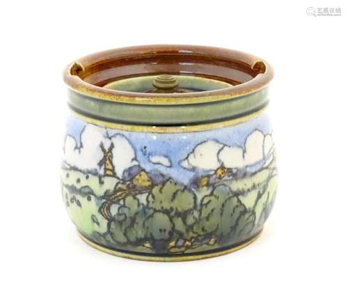 A Royal Doulton stoneware tobacco jar with landscape decorat...