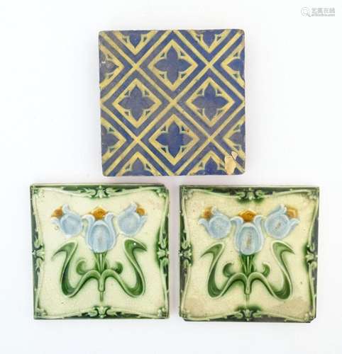 Two Art Nouveau tile with floral and foliate detail. Togethe...