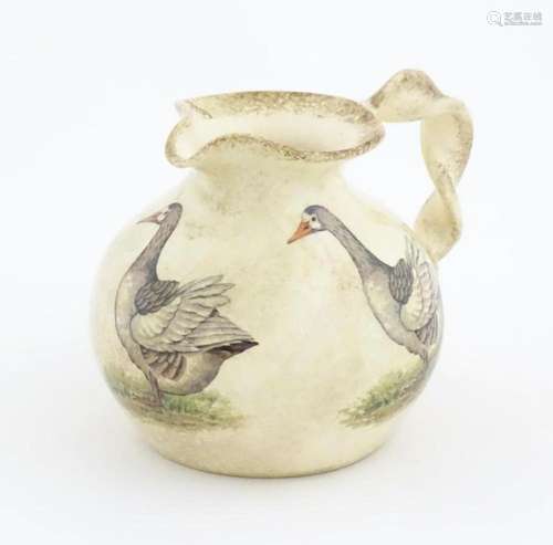 A Yorkshire Moorlands pottery jug with twist handle decorate...