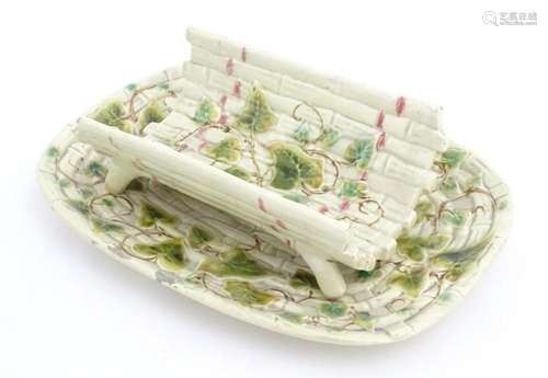 A majolica style asparagus dish / drainer and stand with bas...