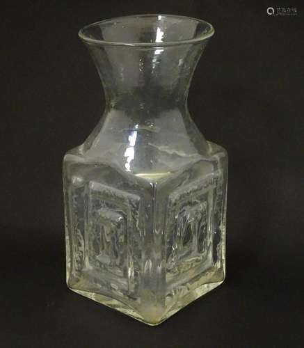 A clear glass vase with Greek key pattern designed by Frank ...