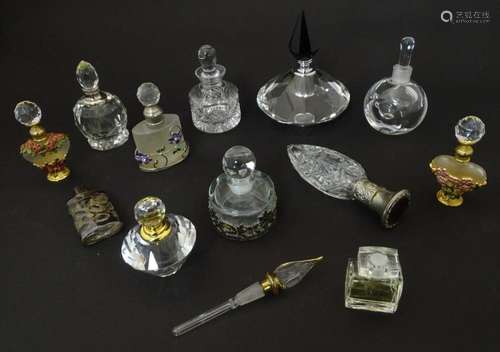 A quantity of assorted glass and crystal scent / perfume bot...