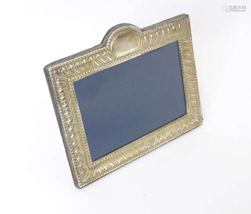 An easel back photograph frame with silver surround hallmark...