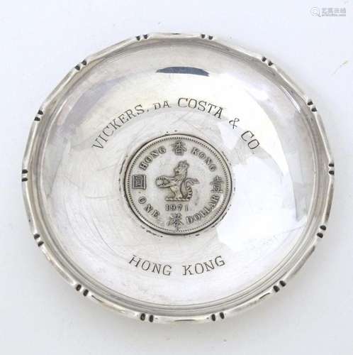 A silver dish of circular form with inset Hong Kong 1971 One...