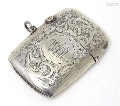 A silver vesta case with engraved decoration, hallmarked Bir...