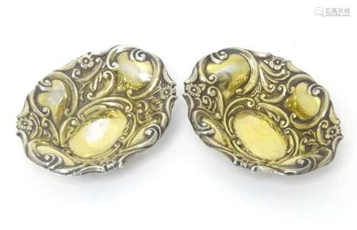 A pair of Victorian silver salt / pin dishes of oval form wi...