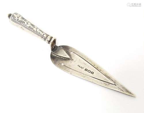 A silver bookmark / paper clip of trowel form with engraved ...