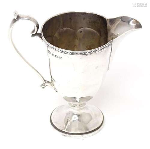 A silver cream jug hallmarked Birmingham 1928, maker Mappin ...