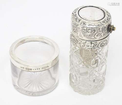 A cut glass atomiser with embossed silver lid hallmarked Bir...