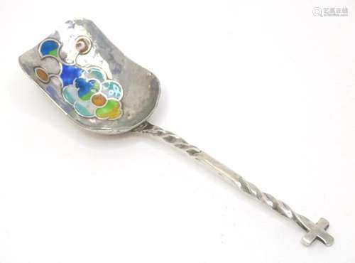 A silver sugar shovel, the hammered bowl with enamel decorat...