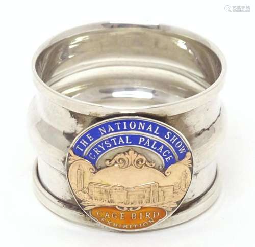 A silver napkin ring with emblem for The National Show Cryst...