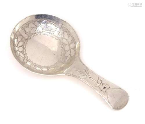 A Geo III silver caddy spoon with engraved decoration, hallm...