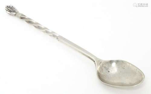 An 18th / 19thC white metal spoon with twist handle surmount...