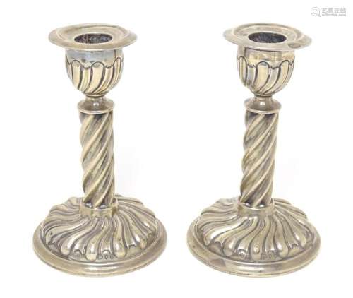 A pair of Victorian silver candlesticks with twist detail, h...