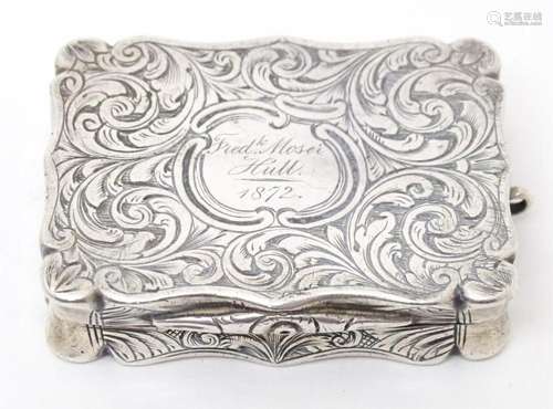 A Victorian silver vinaigrette box with engraved decoration ...