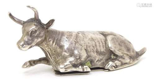 A small silver box / snuff formed as a recumbent cow with hi...