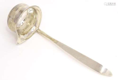 A small silver ladle hallmarked Sheffield 1933, maker Cooper...