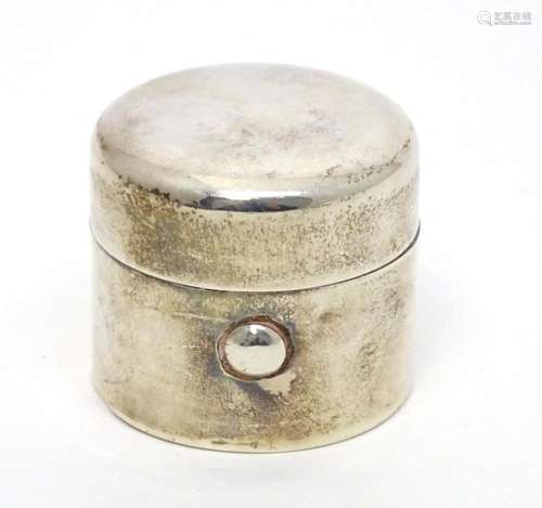 A silver travelling inkwell of cylindrical form with hinged ...