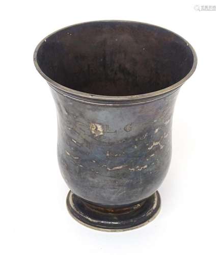 A white metal beaker, maker PD. Approx. 3 1/2" high