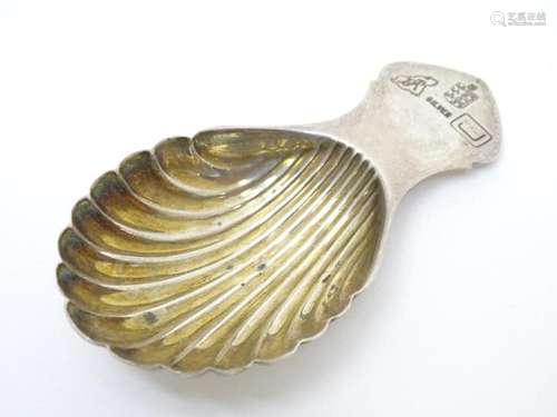 A silver caddy spoon with shell formed bowl. maker BR 3 1/4&...