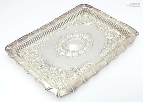 A silver tray with embossed acanthus scroll decoration hallm...