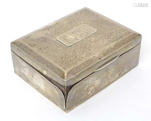 A silver cigarette box hallmarked Chester 1924, maker Stokes...