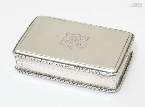 A Victorian silver snuff box with engine turned decoration. ...