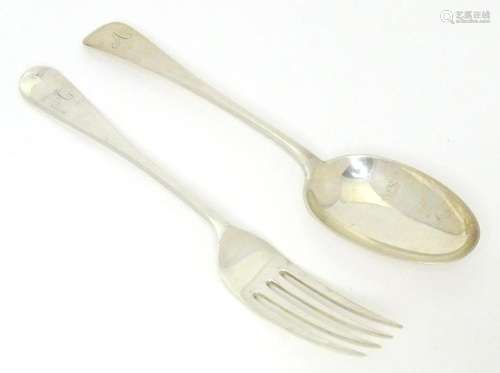 A silver spoon and fork, hallmarked London 1913, maker Josia...