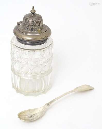 A Victorian cut glass cruet bottle with a silver lid hallmar...