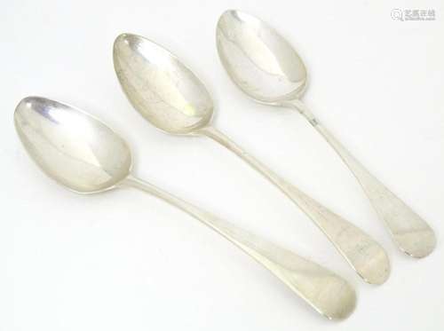 Three various silver dessert spoons, one Geo III example hal...