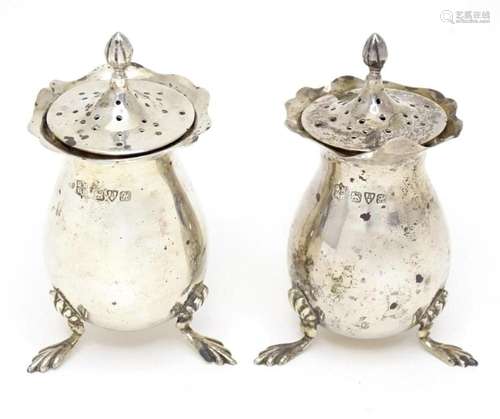 A pair of pepperettes, hallmarked Chester 1908, maker George...