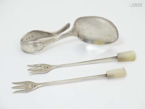 A pair of silver small pickle forks with mother of pearl han...