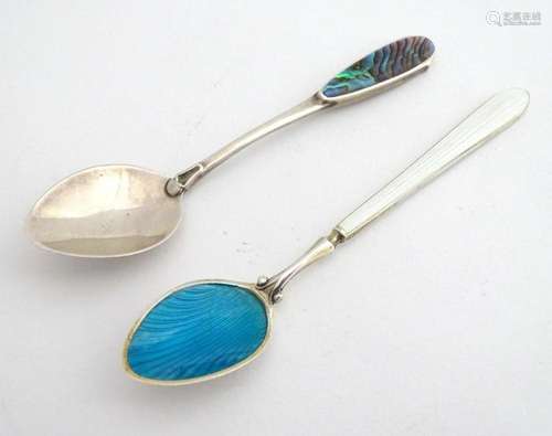 A silver tea spoon having turquoise guilloche enamel decorat...