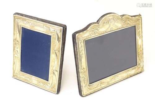 Two easel back photograph frames with silver surrounds, both...