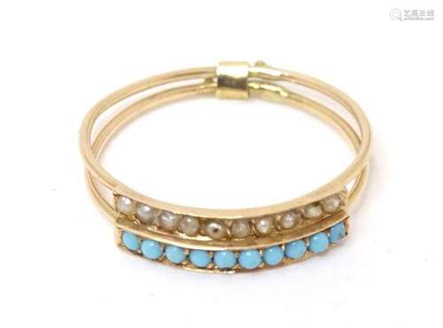 A gold twin band ring set with turquoise and seed pearls. Ri...