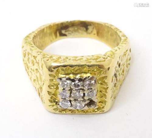 A yellow metal ring set with 8 diamonds. Indistinctly marked...