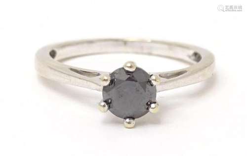 A white gold ring set with central sapphire. Ring size appro...