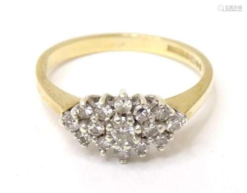 A 9ct gold ring set with diamonds. Ring size approx. L