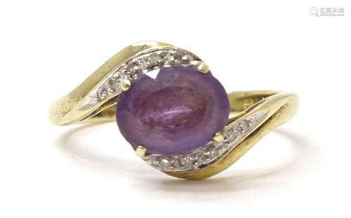 A 9ct gold ring set with amethyst and diamonds. Ring size ap...