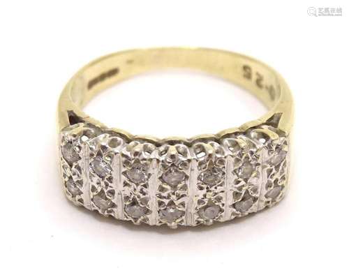 A 9ct gold ring set with 14 diamonds. Ring size approx. L