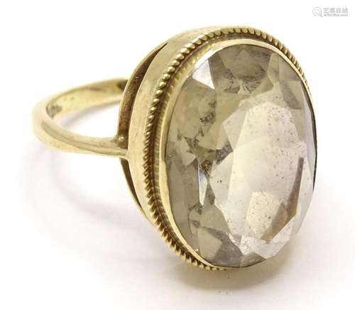 A 9ct gold cocktail ring set with central citrine. Ring size...