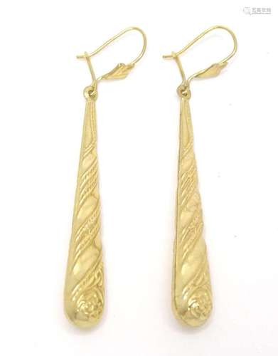 A pair of 9ct gold drop earrings. 2 1/4" long