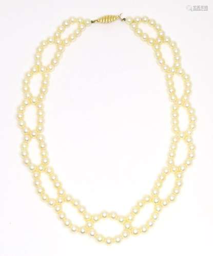 A two stand pearl choker necklace with 18ct gold clasp. Appr...