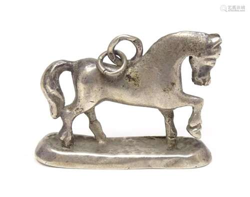 A silver fob / pendant charm modelled as a horse. Approx 3/4...