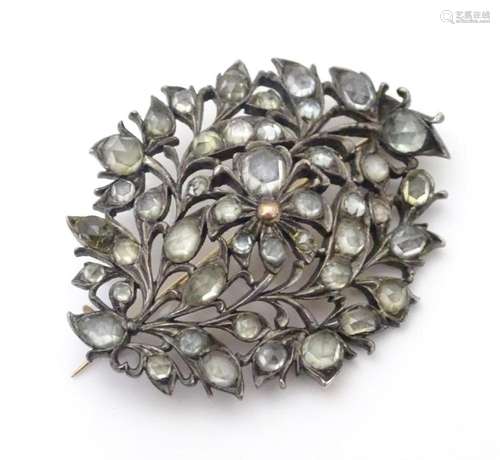 A 19thC Sri Lankan white metal brooch set with Matara style ...